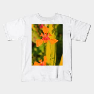 Orange lily blossom on yellow background Kids T-Shirt